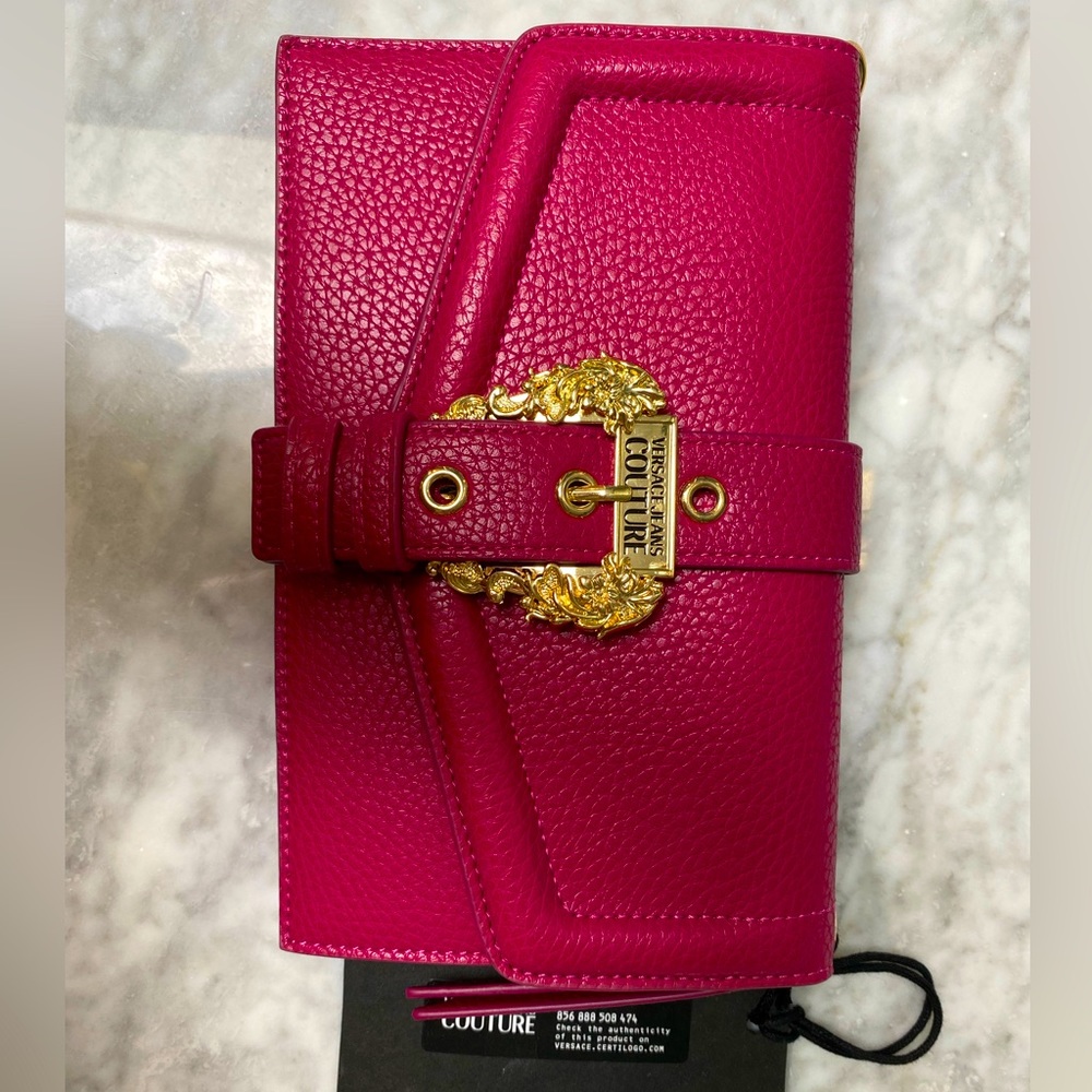 Brand new Versace Couture logo belt buckle clutch. Beautiful fuchsia color.
